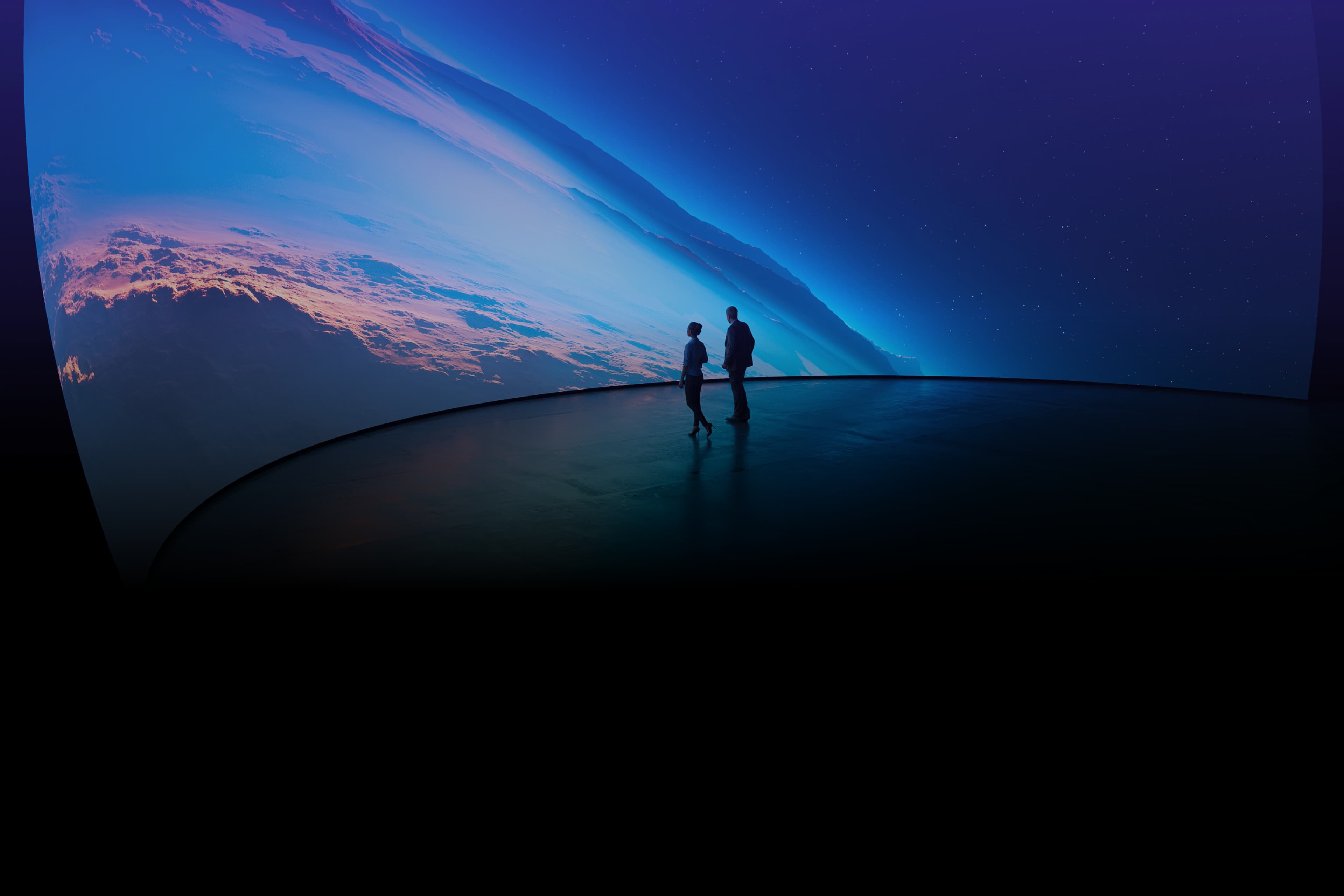 People observing a large curved screen showcasing Screenberry software capabilities