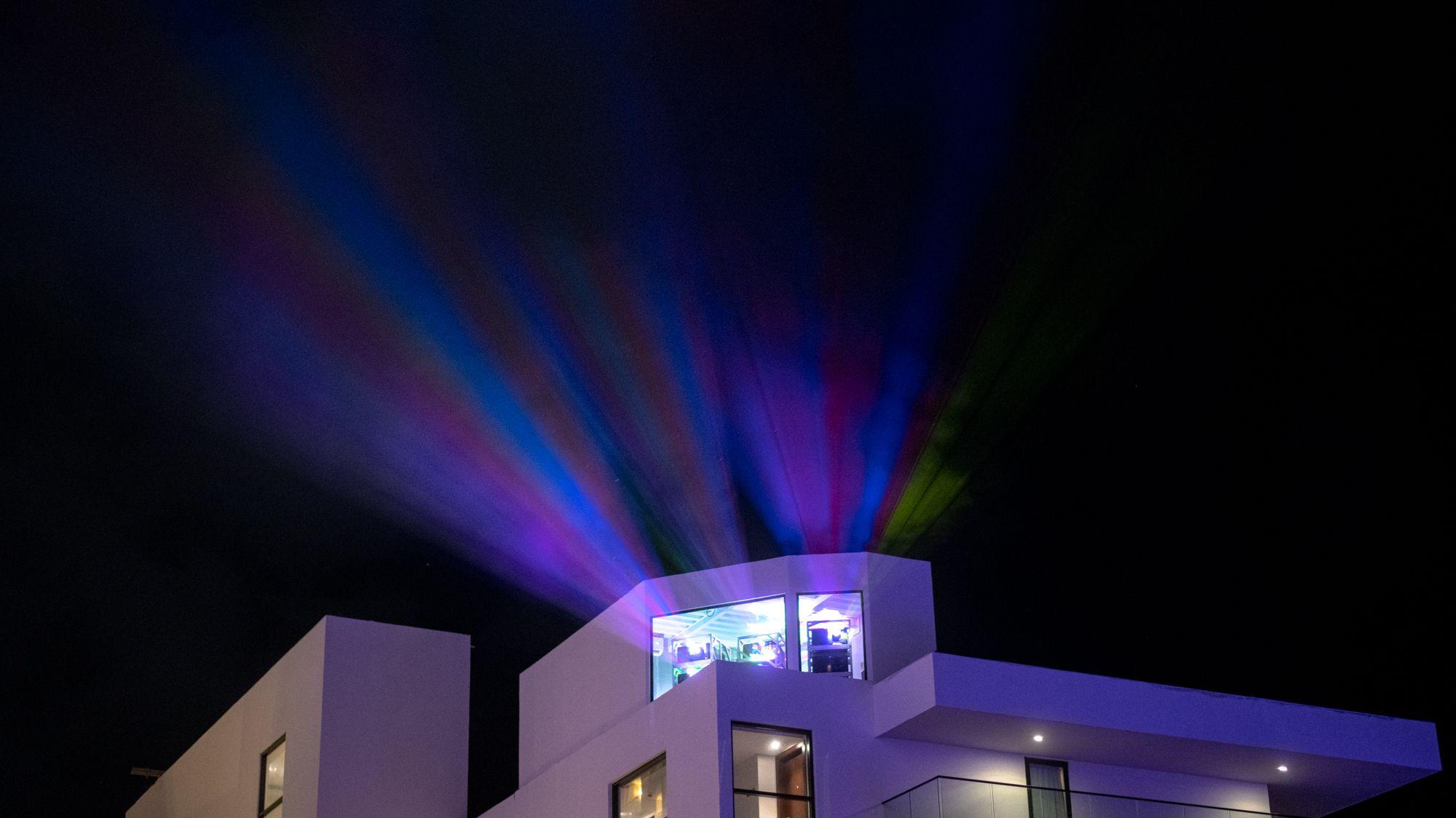 Projectors shining onto the Melody Maker Cancun Hotel