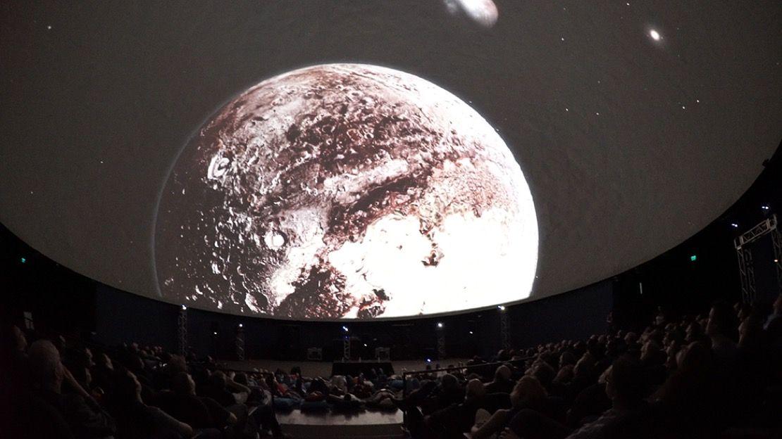Audience in a dome theater watching a fulldome show during the Seattle International Film Festival