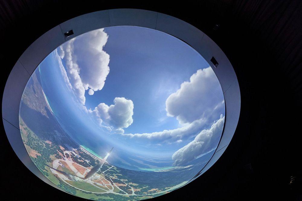 Screenberry-driven dome projection inside an industrial chimney at UNIT.City displaying an image of the space rocket launch