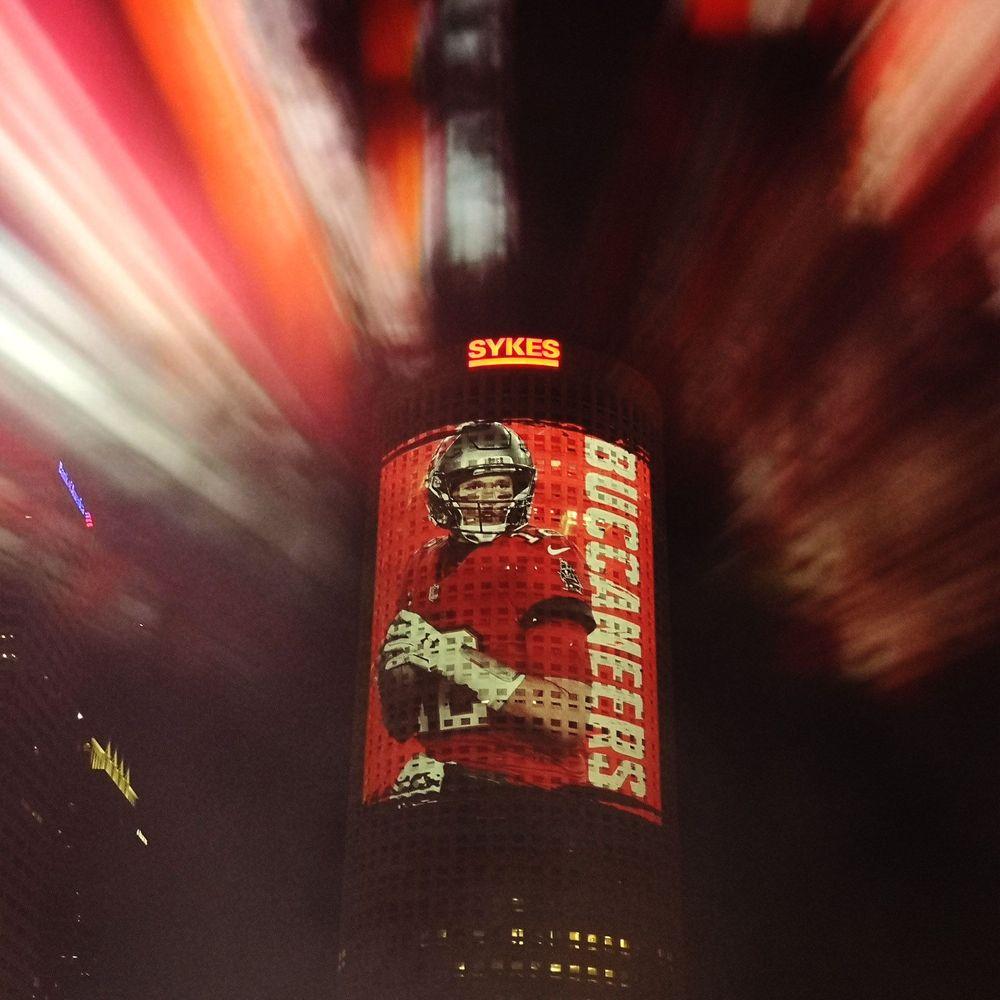Rivergate Tower with a giant vinyl wrap illuminated with a Screenberry-driven architectural projection during Super Bowl LV