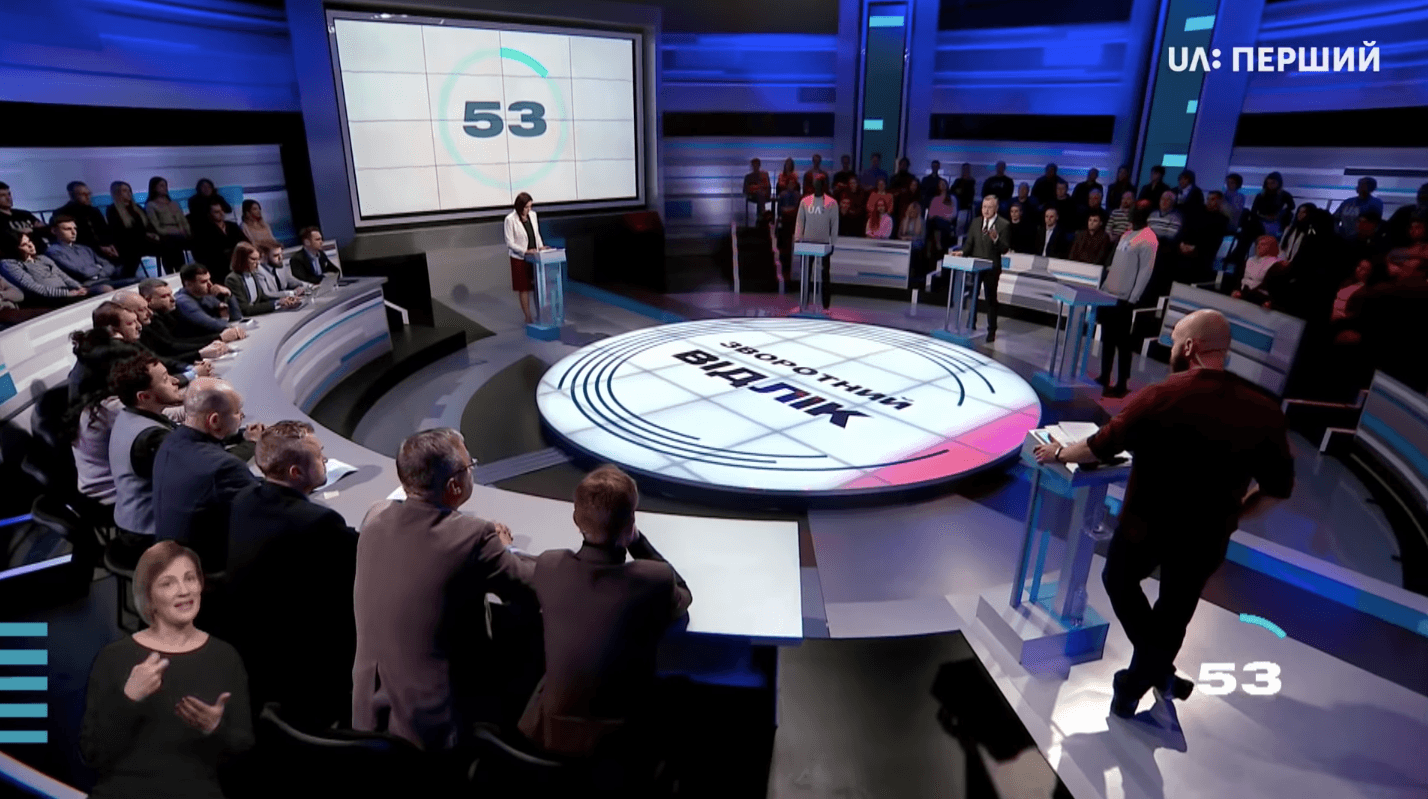 A group of people at a TV studio equipped with a Screenberry-driven video wall