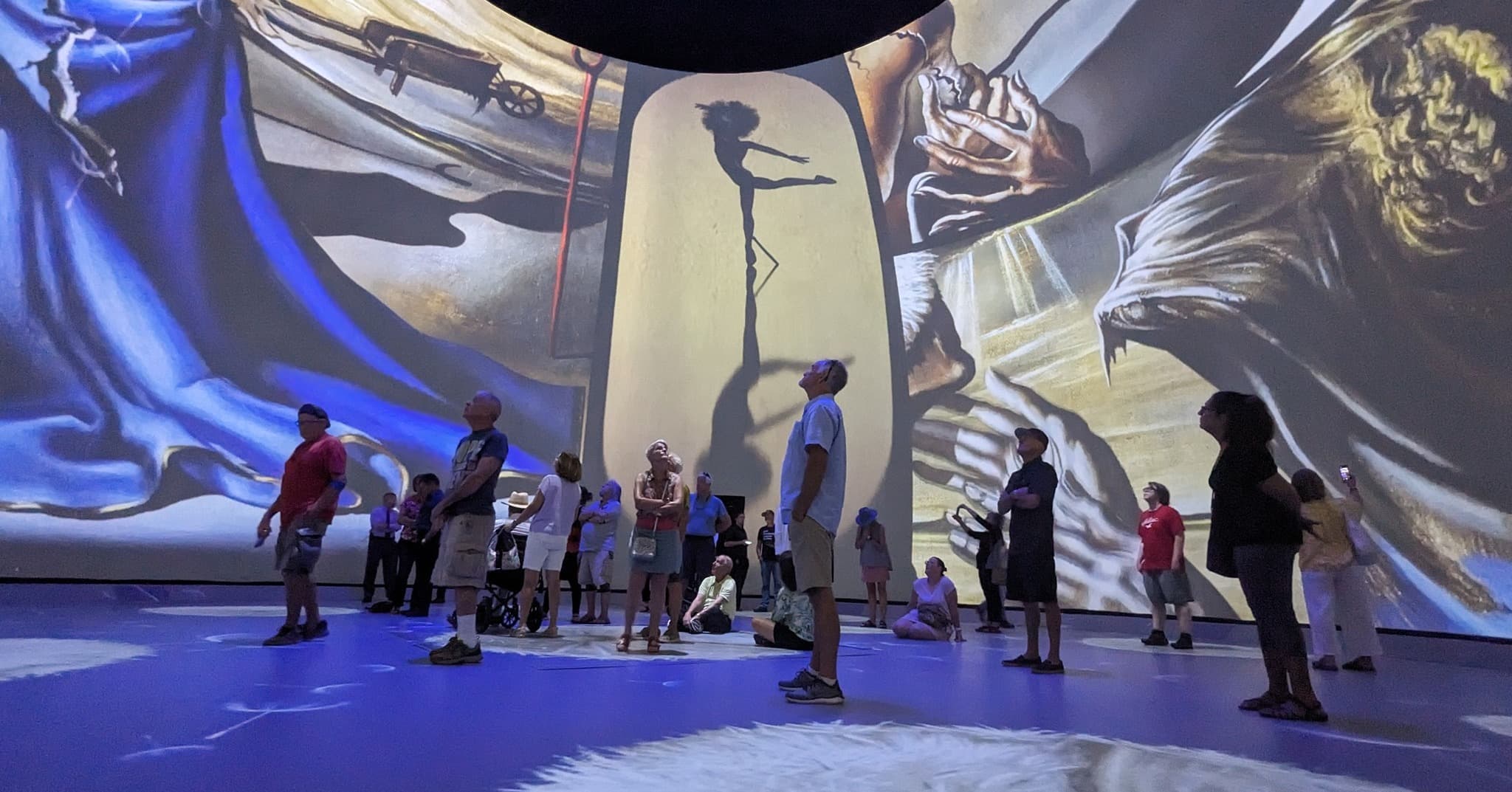 People enjoying Screenberry-powered projections at the 'Dalí Alive 360' experience.