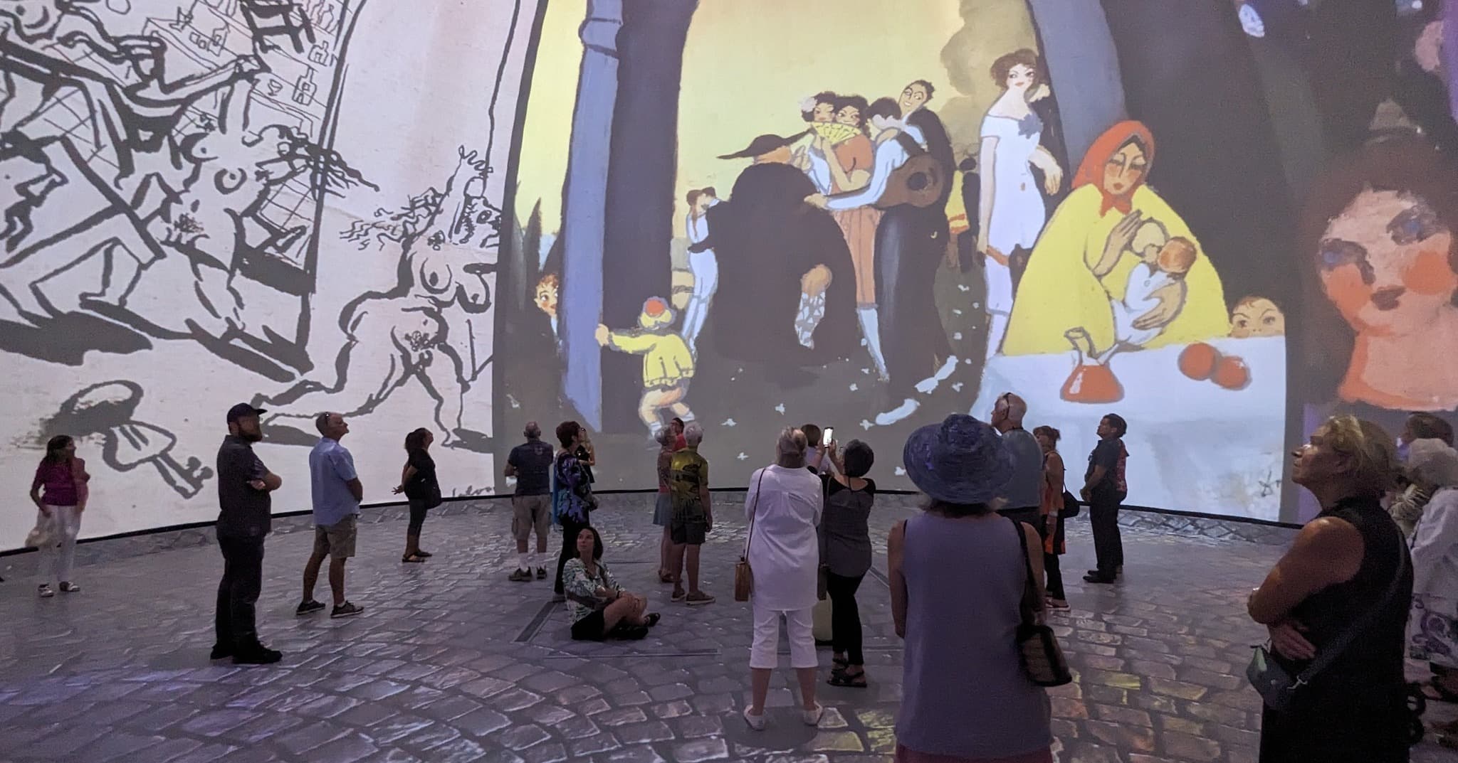 People enjoying Screenberry-driven projections at the 'Dalí Alive 360' experience.