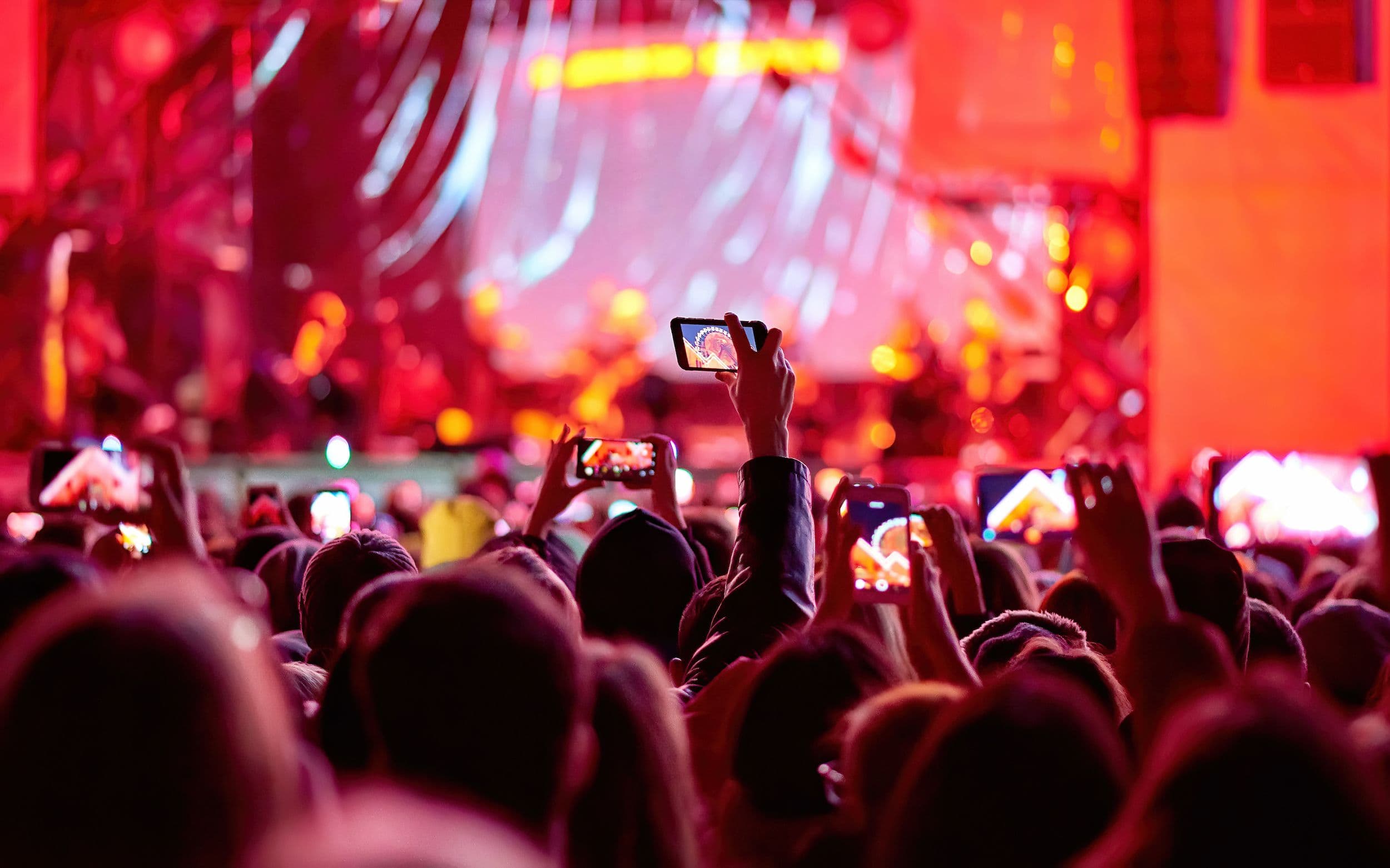 People making pictures of the projection mapped Ferris wheel