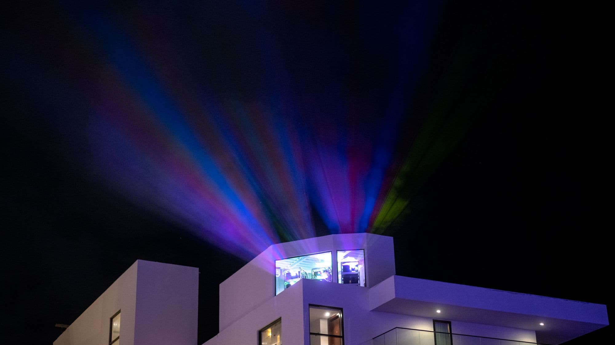Projectors shining onto the Melody Maker Cancun Hotel