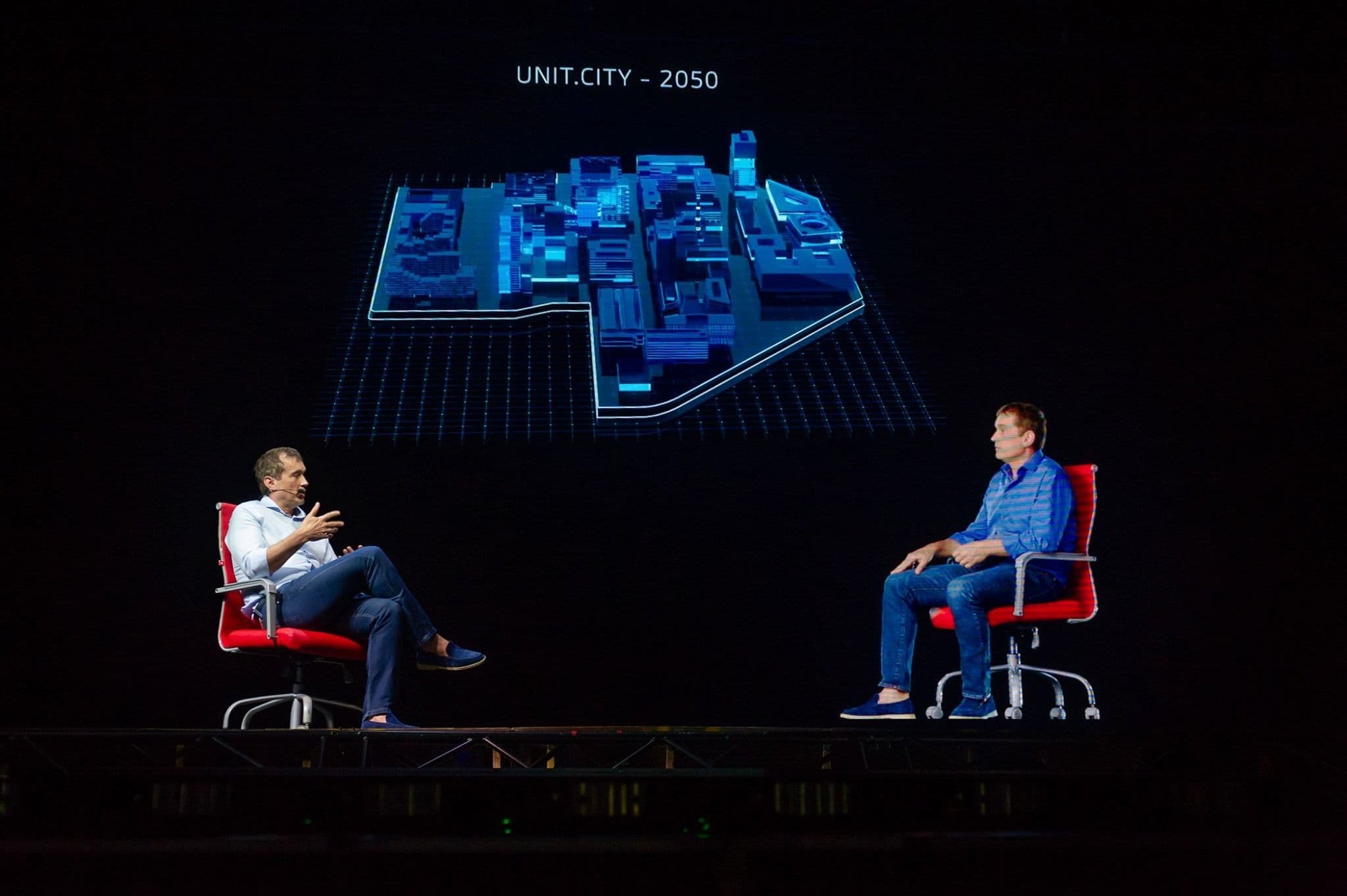 A presenter interacting with a hologram as part of a Screenberry-powered holographic presentation at the SME Development Forum